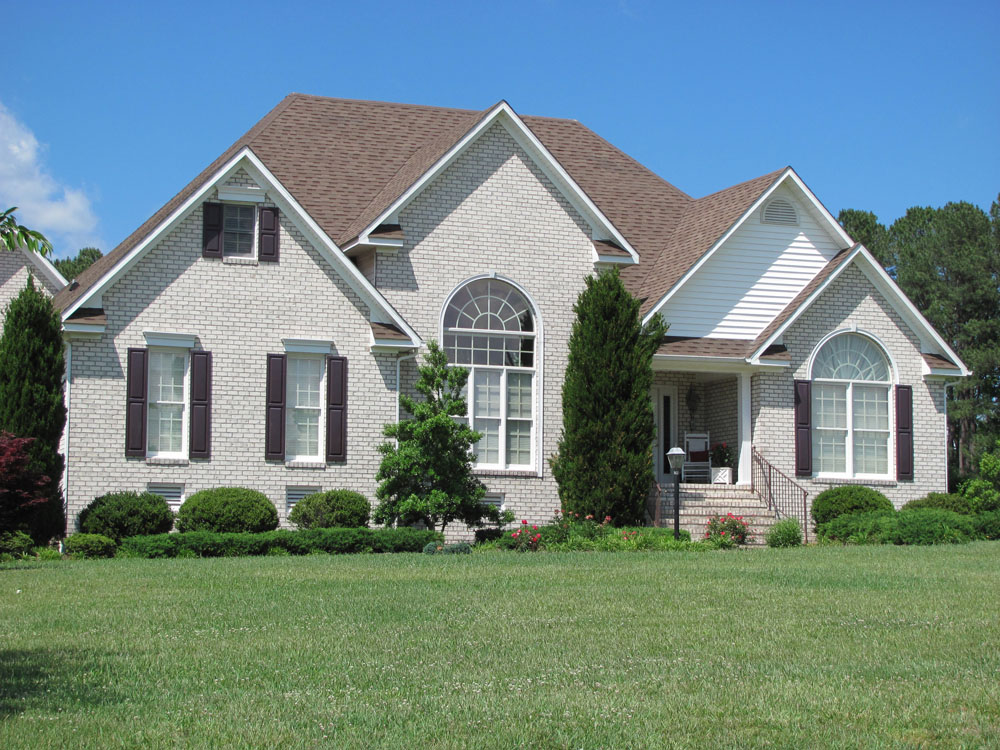 Brick house exterior with arched windows